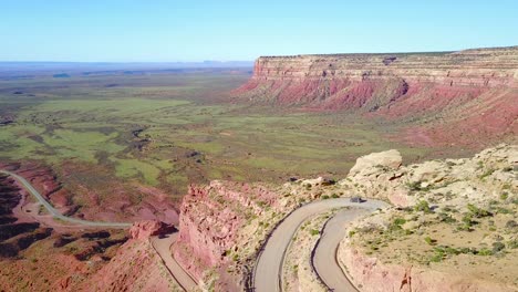Aerial-as-a-car-travels-on-the-dangerous-mountain-road-of-Moki-Dugway-New-Mexico-desert-Southwest