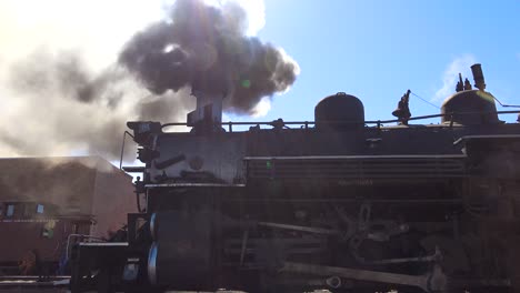 Low-angle-of-Cumbres-and-Toltec-steam-train-leaving-station
