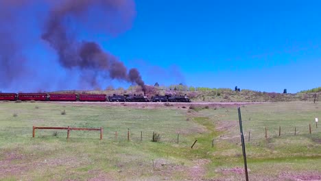 Traveling-shot-of-Cumbres-and-Toltec-steam-train-moving-through-Colorado-mountains-near-Chama-New-Mexico-1