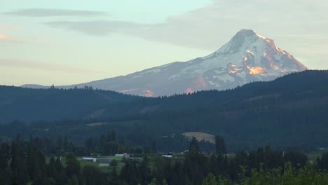 Sunset-light-on-Mt-Hood-near-Hood-River-Oregon-with-farms-and-fields-foreground-1