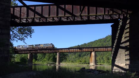 A-coal-train-travels-over-a-bridge-loaded-with-cargo-in-West-Virginia