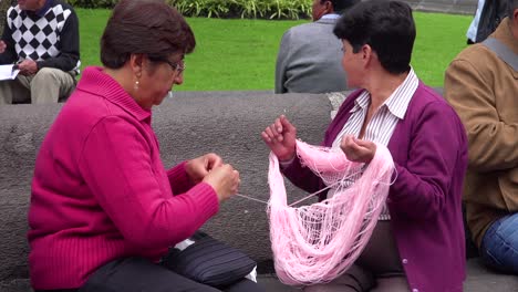 Two-women-knit-and-sew-in-the-park-in-Quito-Ecuador