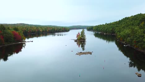 A-beautiful-aerial-over-an-island-in-the-middle-of-a-lake-in-Maine-New-Hampshire-or-Vermont