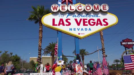 2017---thousands-of-candles-and-signs-form-a-makeshift-memorial-at-the-base-of-the-Welcome-to-Las-Vegas-sign-following-Americas-worst-mass-shooting-3