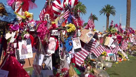 2017---thousands-of-candles-and-signs-form-a-makeshift-memorial-at-the-base-of-the-Welcome-to-Las-Vegas-sign-following-Americas-worst-mass-shooting-8