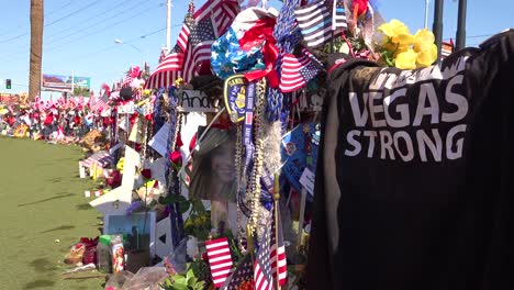 2017---thousands-of-candles-and-signs-form-a-makeshift-memorial-at-the-base-of-the-Welcome-to-Las-Vegas-sign-following-Americas-worst-mass-shooting-17