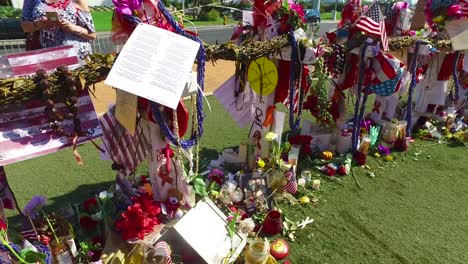 2017---thousands-of-candles-and-signs-form-a-makeshift-memorial-at-the-base-of-the-Welcome-to-Las-Vegas-sign-following-Americas-worst-mass-shooting-23