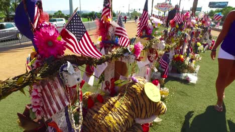 2017---thousands-of-candles-and-signs-form-a-makeshift-memorial-at-the-base-of-the-Welcome-to-Las-Vegas-sign-following-Americas-worst-mass-shooting-24