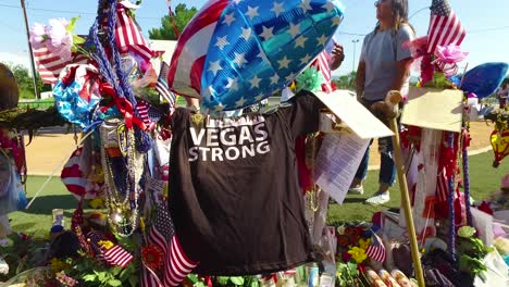 2017---thousands-of-candles-and-signs-form-a-makeshift-memorial-at-the-base-of-the-Welcome-to-Las-Vegas-sign-following-Americas-worst-mass-shooting-25
