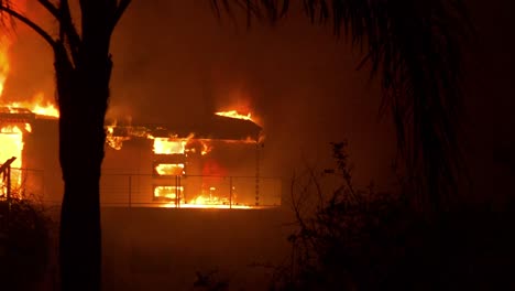 Pan-across-to-reveal-a-burning-home-at-night-during-the-2017-Thomas-fire-in-Ventura-County-California-1