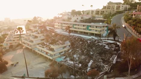 Aerial-over-a-hillside-apartment-building-destroyed-by-fire-in-Ventura-California-following-the-Thomas-wildfire-in-2017-5