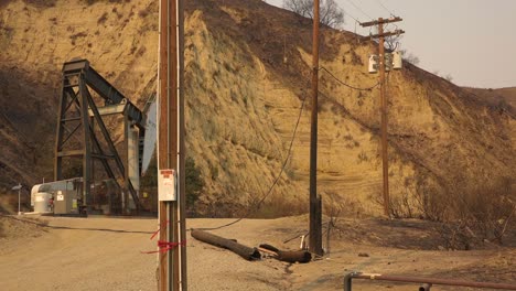 A-telephone-line-is-burned-in-half-and-destroyed-causing-a-power-failure-during-the-Thomas-fire-in-Ventura-County-California