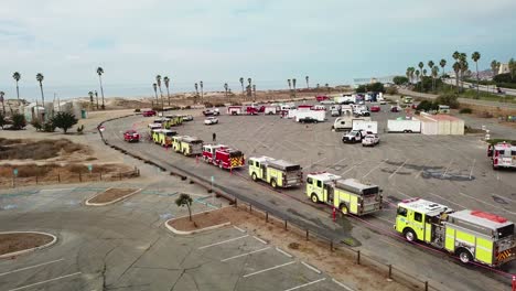 Aerial-of-firefighters-in-fire-trucks-lining-up-for-duty-at-a-staging-area-during-the-Thomas-Fire-in-Ventura-California-in-2017