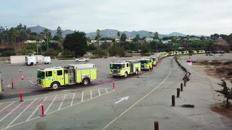 Aerial-of-firefighters-in-fire-trucks-lining-up-for-duty-at-a-staging-area-during-the-Thomas-Fire-in-Ventura-California-in-2017-1