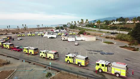 Aerial-of-firefighters-in-fire-trucks-lining-up-for-duty-at-a-staging-area-during-the-Thomas-Fire-in-Ventura-California-in-2017-5