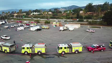 Aerial-of-firefighters-in-fire-trucks-lining-up-for-duty-at-a-staging-area-during-the-Thomas-Fire-in-Ventura-California-in-2017-6