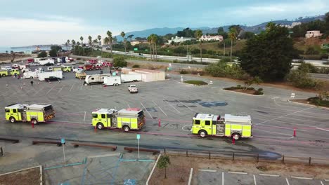 Aerial-of-firefighters-in-fire-trucks-lining-up-for-duty-at-a-staging-area-during-the-Thomas-Fire-in-Ventura-California-in-2017-7