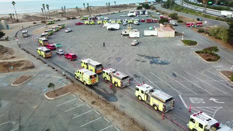 Aerial-of-firefighters-in-fire-trucks-lining-up-for-duty-at-a-staging-area-during-the-Thomas-Fire-in-Ventura-California-in-2017-8