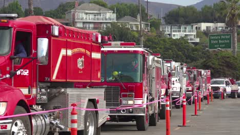 Firefighters-in-fire-trucks-lining-up-for-duty-at-a-staging-area-during-the-Thomas-Fire-in-Ventura-California-in-2017