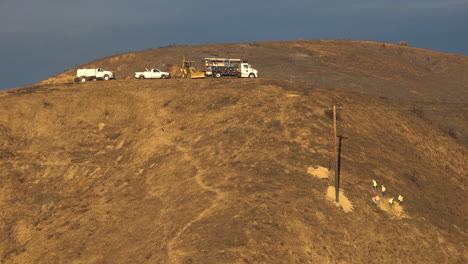 A-SCE-telephone-lineman-maintenance-crew-works-on-power-lines-on-burned-hills-following-the-disastrous-Thomas-Fire