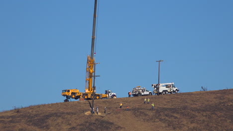 A-SCE-telephone-lineman-maintenance-crew-works-on-power-lines-on-burned-hills-following-the-disastrous-Thomas-Fire-2