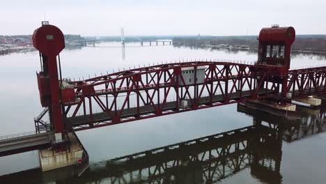 Aerial-shot-of-a-railroad-drawbridge-lifting-or-raising-over-the-Mississippi-River-near-Burlington-Iowa