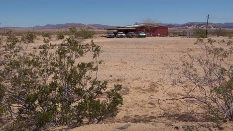 Old-classic-Cadillac-cars-and-other-vintage-automobiles-sit-outside-a-remote-ranch-house-in-the-Mojave-Desert-1