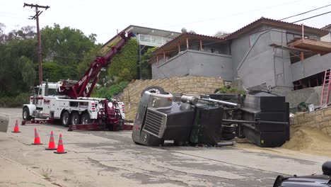 A-dump-truck-rolls-over-during-an-accident-on-a-construction-site