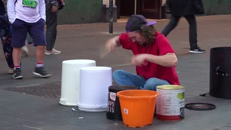A-street-musician-plays-drums-on-a-London-street