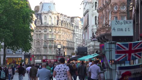 Lots-of-foot-traffic-and-pedestrians-move-through-Leicester-Square-London-England