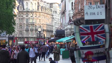 Lots-of-foot-traffic-and-pedestrians-move-through-Leicester-Square-London-England-1