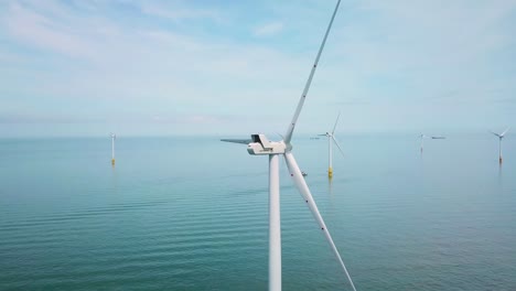 Remarkable-drone-aerial-over-windmills-and-turbines-in-the-ocean-off-the-coast-of-England