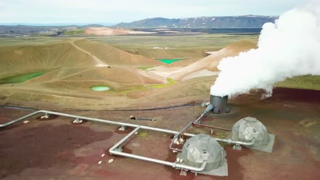 Beautiful-drone-shot-of-the-Krafla-geothermal-area-in-Iceland-with-pipes-steaming-vents-and-sheep-warming-themselves