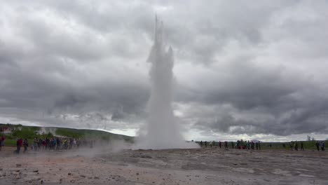 Iceland's-famous-Strokkur-geysir-geyser-erupts-with-tourists-watching-1