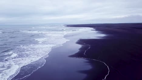 Haunting-beautiful-aerial-over-a-black-sand-beach-in-Southern-Iceland-1