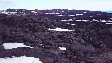 Aerial-over-vast-lava-fields-and-snow-near-Askja-Iceland