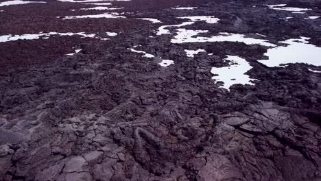 Aerial-over-vast-lava-fields-and-snow-near-Askja-Iceland-2