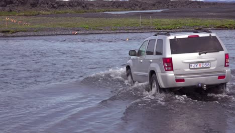 A-SUV-drives-through-a-river-in-the-remote-highlands-of-Iceland-2