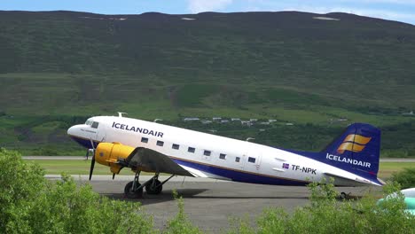 An-Icelandair-DC-3-prop-plane-sits-on-a-runway-at-an-airport