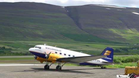 An-Icelandair-DC-3-prop-plane-sits-on-a-runway-at-an-airport-1