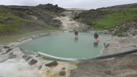 Tourists-bathe-in-the-Hveravellir-hot-springs-natural-geothermal-baths-in-the-highlands-of-central-Iceland-1