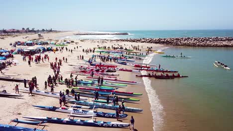 Aerial-over-outrigger-canoes-on-a-beach-during-a-rowing-race-on-the-Pacific-ocean-near-Ventura-California