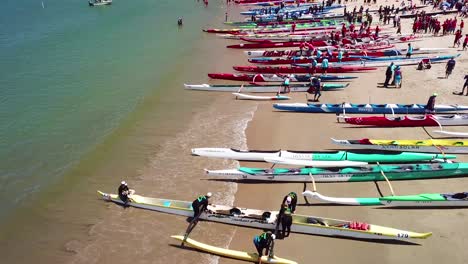 Aerial-over-outrigger-canoes-on-a-beach-during-a-rowing-race-on-the-Pacific-ocean-near-Ventura-California-2