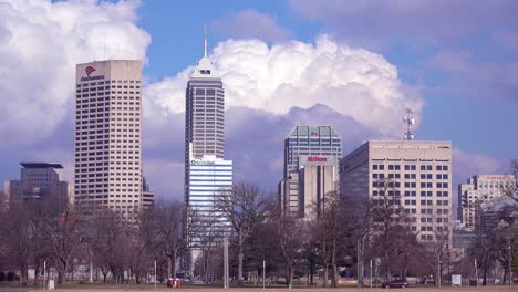 Unusual-time-lapse-of-Indianapolis-Indiana-with-traffic-moving-normally-in-lower-half-and-downtown-city-skyline-and-clouds-in-timelapse-above