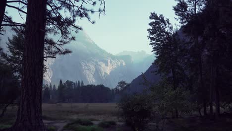 Zoom-out-of-early-morning-light-raking-across-a-granite-wall-in-the-Yosemite-Valley-Yosemite-National-Park-California
