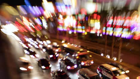 Selective-focus-image-of-the-electricity-and-energy-of-bright-lights-and-traffic-on-the-strip-at-night-in-Las-Vegas-Nevada