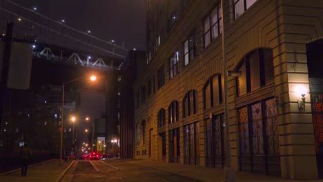 Establishing-shot-of-warehouses-under-the-Brooklyn-Bridge-with-subway-train-crossing-1