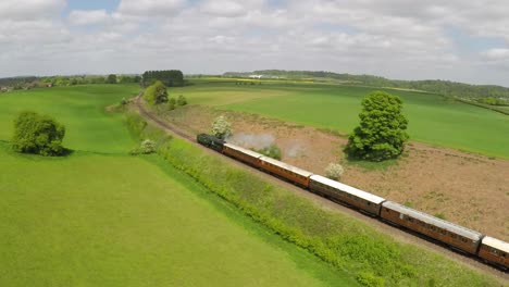 An-aerial-of-a-steam-train-as-it-passes-through-the-English-countryside-at-high-speed-3