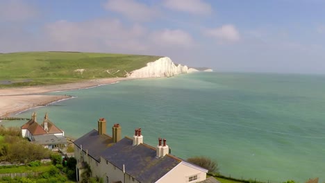 Areal-shot-of-beautiful-houses-along-the-shore-of-the-White-Cliffs-of-Dover-at-Beachy-Head-England-1