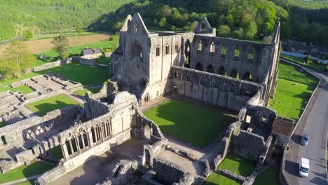 An-amazing-aerial-view-over-the-abandoned-Tintern-Abbey-in-Wales-United-Kingdom